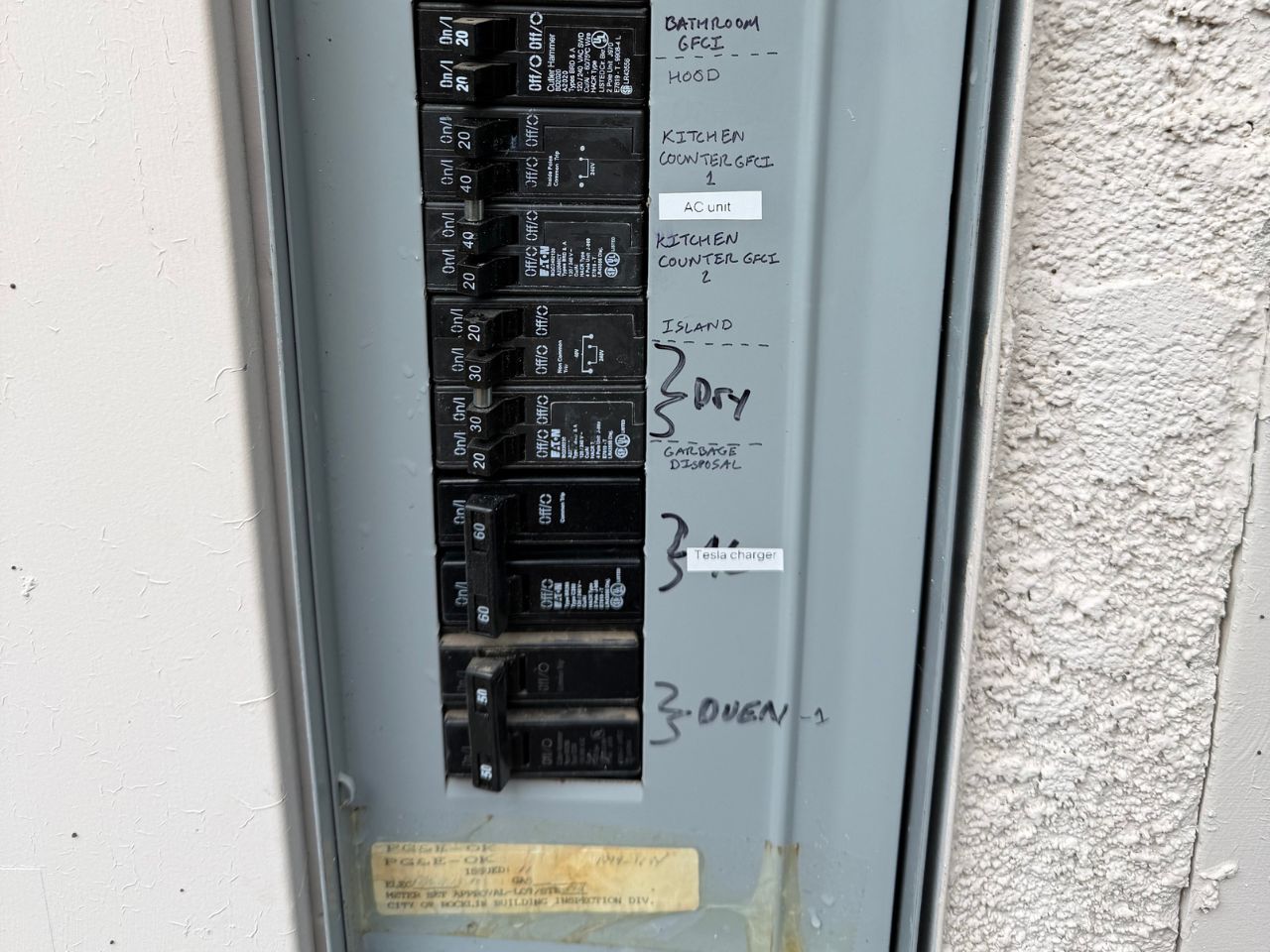 Tesla Wall Connector mounted in a garage